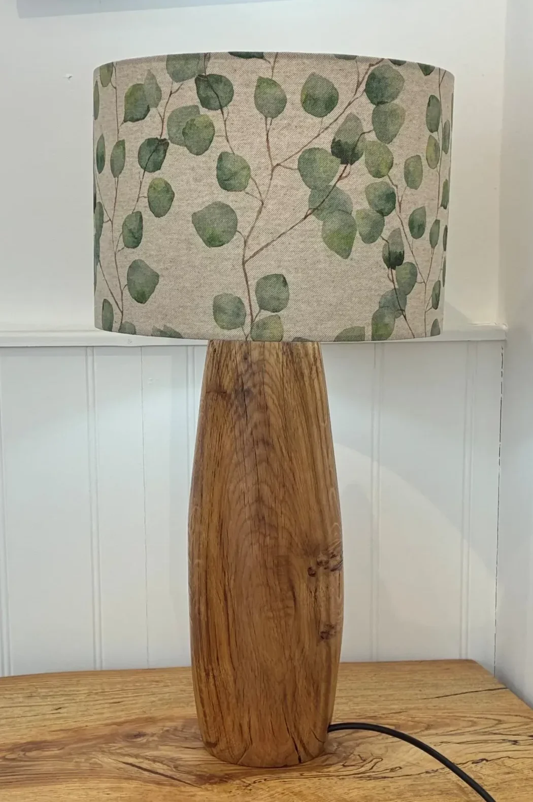 Grey lampshade with green leaves
