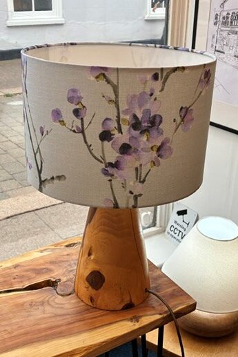 Grey lampshade with purple blossom